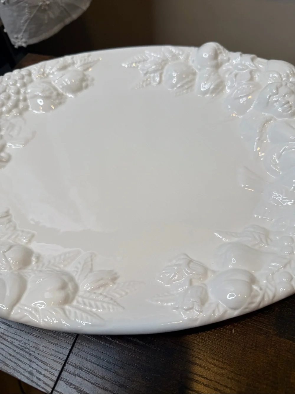 White glazed ceramic oval serving platter classical bacchanalian cherub embossed